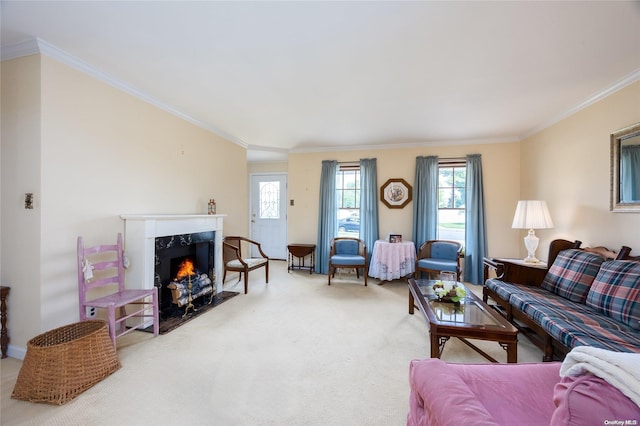 living room featuring a high end fireplace, crown molding, and carpet floors