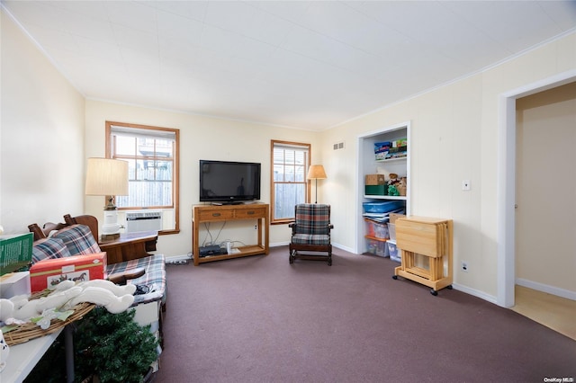 carpeted living room featuring cooling unit and ornamental molding