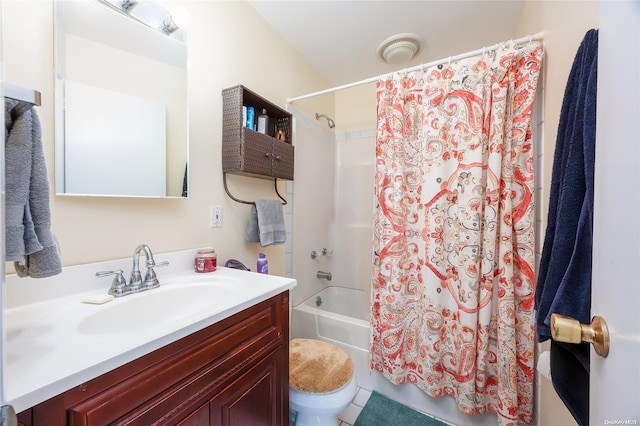 full bathroom with tile patterned floors, shower / bathtub combination with curtain, vanity, and toilet