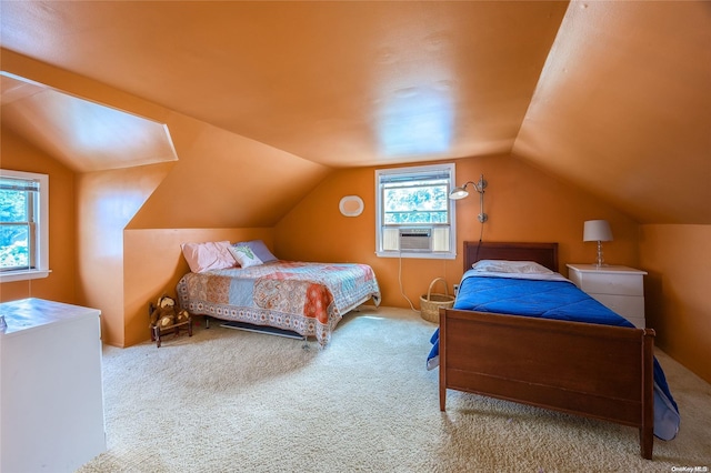 bedroom featuring carpet flooring, multiple windows, cooling unit, and vaulted ceiling