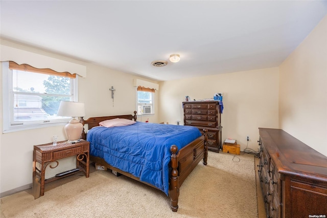 bedroom featuring light colored carpet