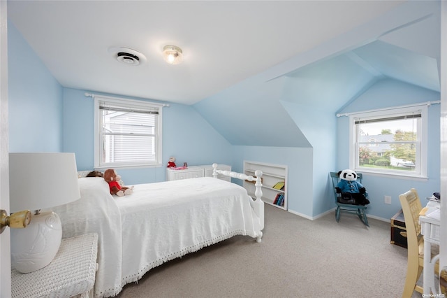 carpeted bedroom featuring lofted ceiling