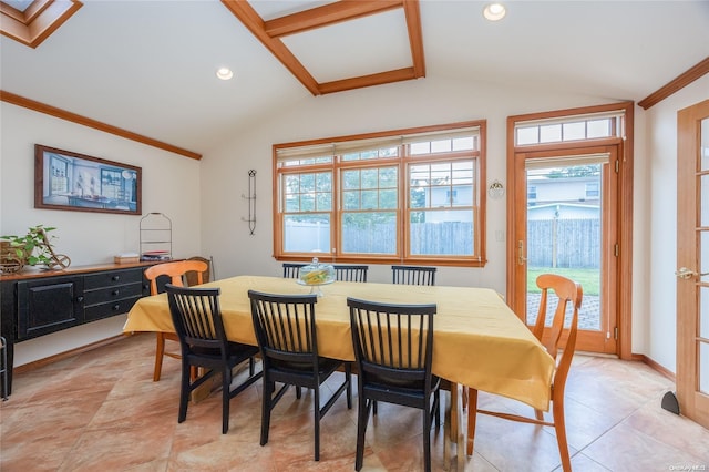 tiled dining space with crown molding and vaulted ceiling