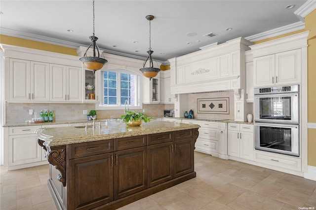 kitchen featuring dark brown cabinets, decorative backsplash, decorative light fixtures, and double oven