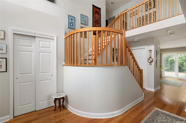 staircase featuring hardwood / wood-style flooring