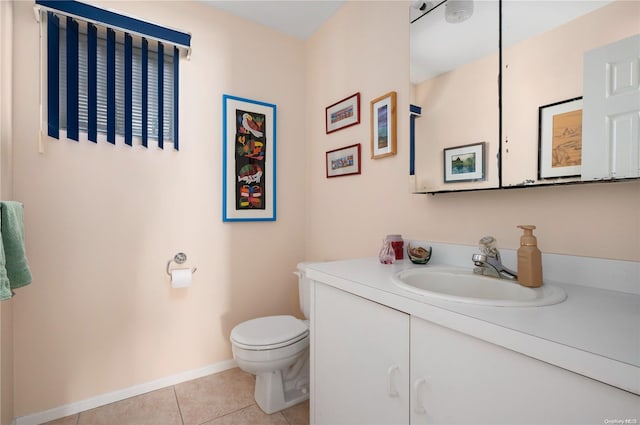 bathroom with tile patterned floors, vanity, and toilet