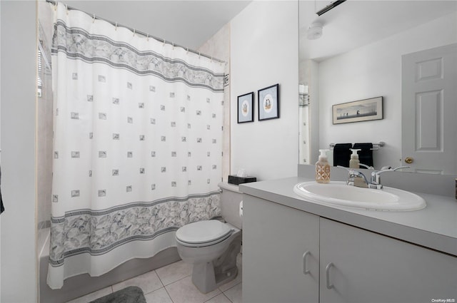 bathroom with tile patterned floors, vanity, and toilet