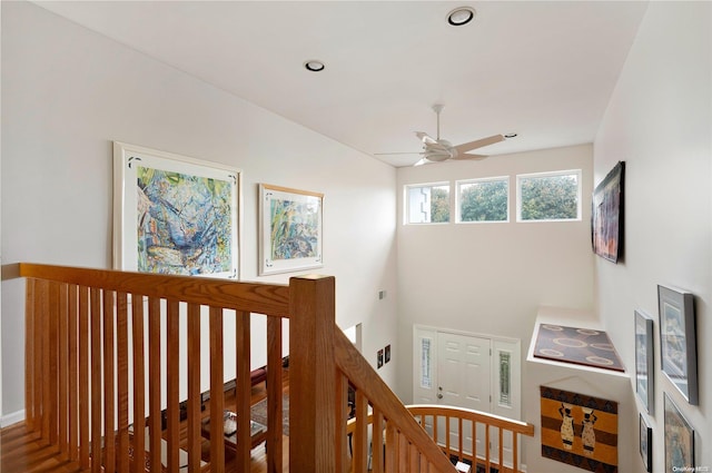 stairway with ceiling fan