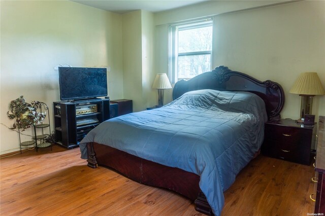 bedroom featuring wood-type flooring