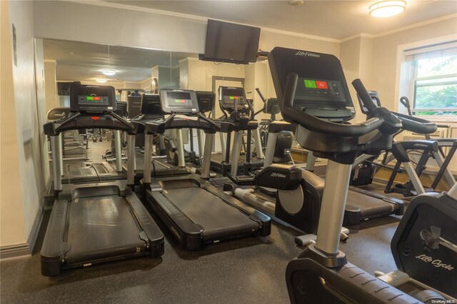 workout area featuring ornamental molding