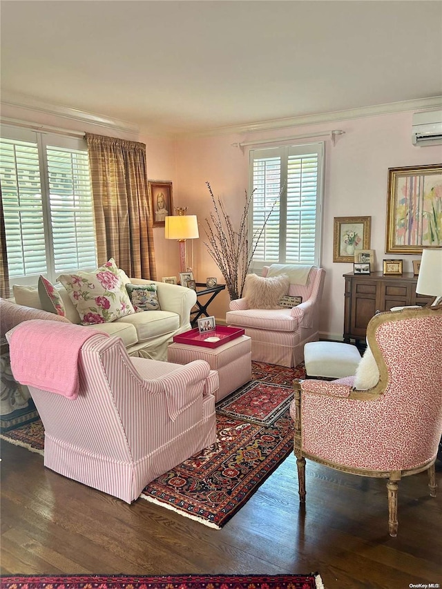 living room with an AC wall unit, dark wood-type flooring, and ornamental molding