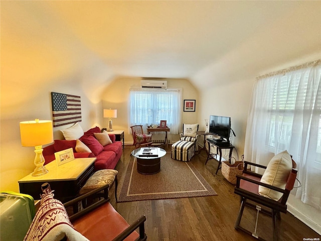 living room featuring a wall mounted air conditioner, dark hardwood / wood-style floors, and vaulted ceiling