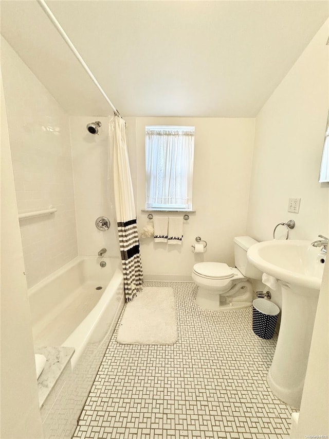 full bathroom with sink, shower / tub combo with curtain, and toilet