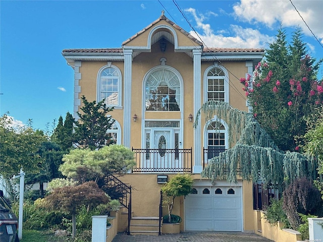 mediterranean / spanish house with a garage