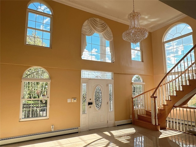 foyer entrance with a healthy amount of sunlight, a towering ceiling, and a baseboard radiator