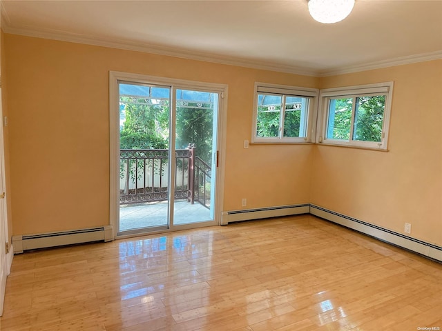 spare room with a healthy amount of sunlight, light hardwood / wood-style floors, and a baseboard radiator