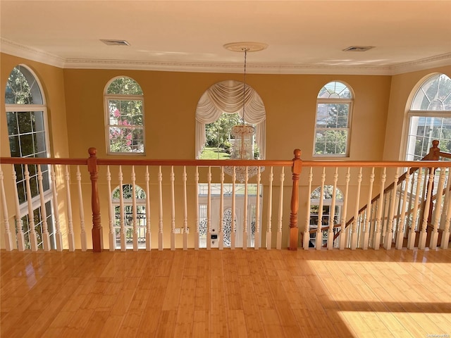 room details featuring hardwood / wood-style floors and crown molding