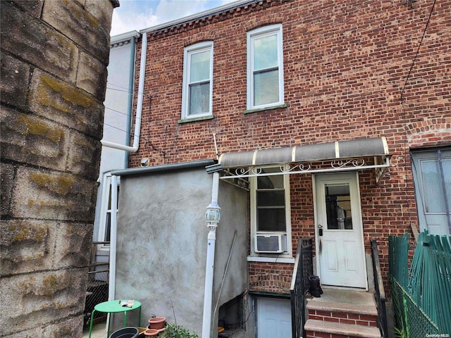 doorway to property featuring cooling unit