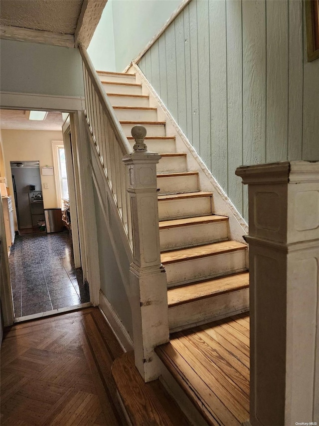 staircase with parquet flooring