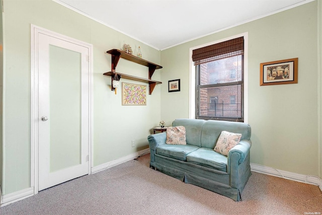 sitting room with light colored carpet and ornamental molding