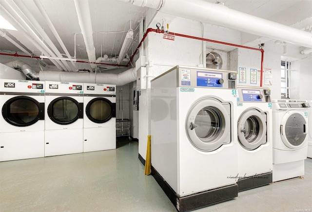 clothes washing area featuring washer and clothes dryer