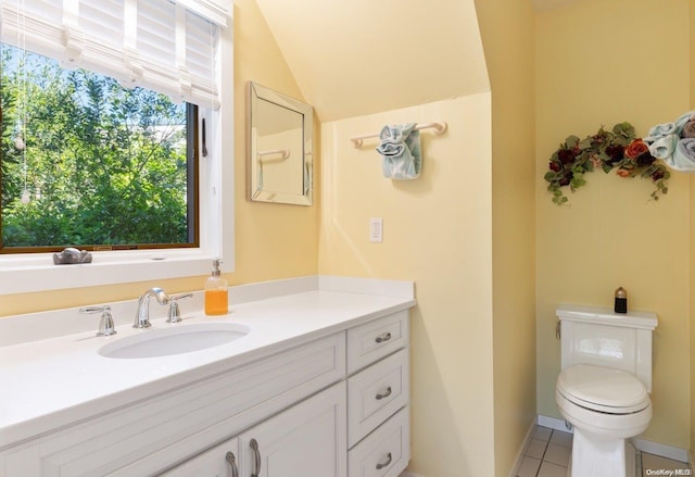 bathroom featuring tile patterned floors, vanity, and toilet