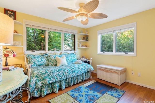 bedroom with ceiling fan and wood-type flooring