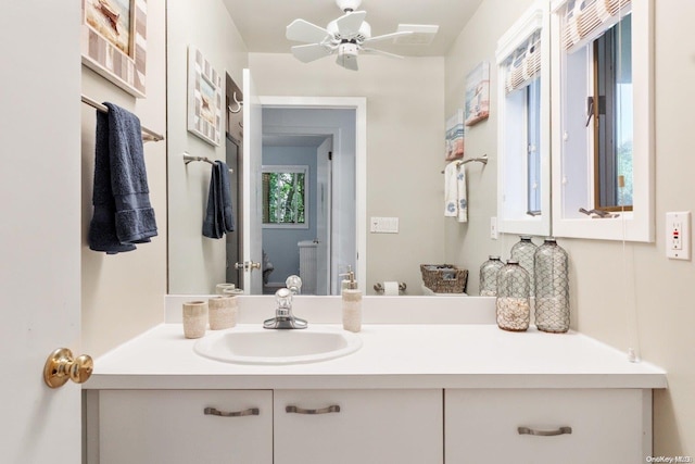 bathroom featuring ceiling fan and vanity