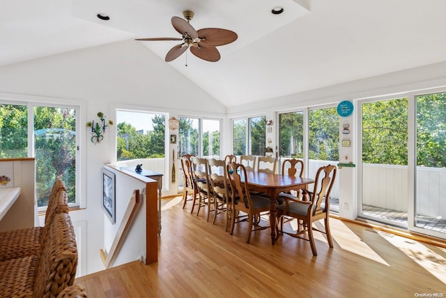 sunroom with ceiling fan and vaulted ceiling