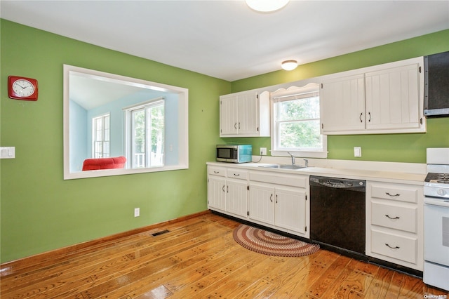 kitchen featuring sink, black dishwasher, white range, white cabinets, and light wood-type flooring