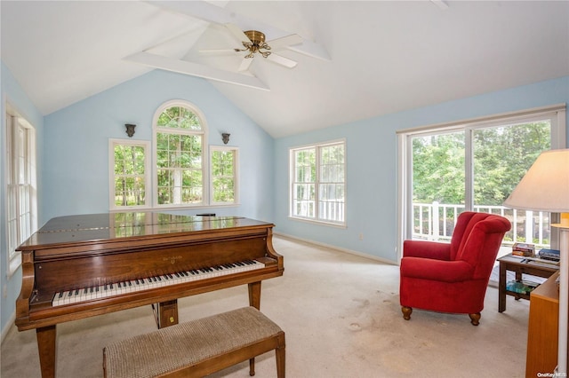 miscellaneous room featuring ceiling fan, light carpet, and lofted ceiling