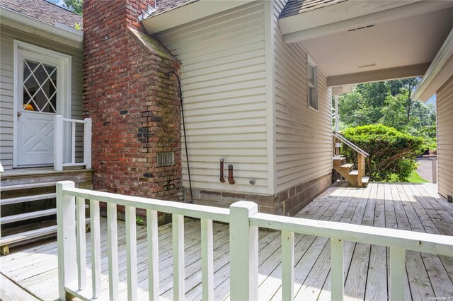 wooden deck featuring stairs