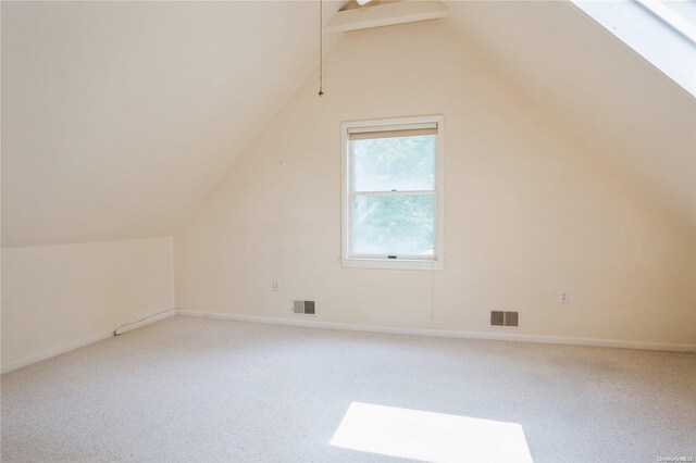 additional living space featuring lofted ceiling, carpet flooring, and baseboards