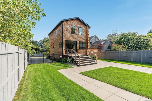 216 N St, Greenport, NY 11944 - back of property with a fenced backyard