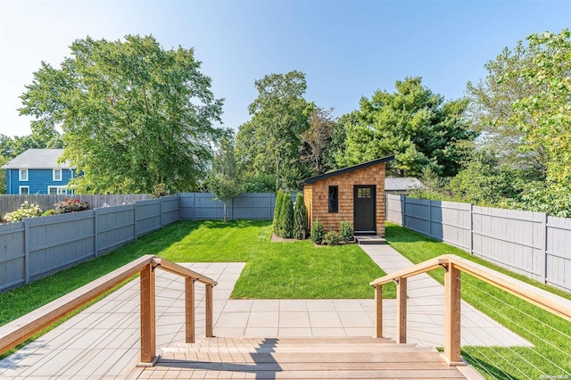 216 N St, Greenport, NY 11944 - wooden deck featuring a fenced backyard and an outdoor structure