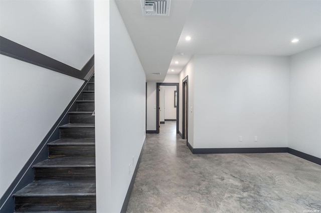 216 N St, Greenport, NY 11944 - staircase with finished concrete flooring and recessed lighting