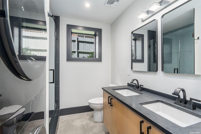 216 N St, Greenport, NY 11944 - full bath with double vanity, a stall shower, and plenty of natural light