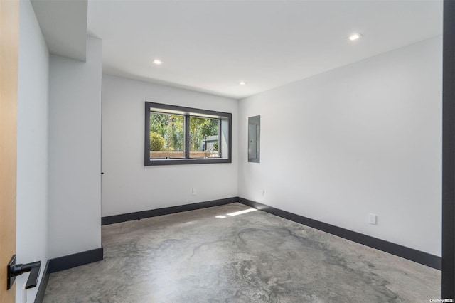 216 N St, Greenport, NY 11944 - unfurnished room with electric panel, concrete floors, and recessed lighting