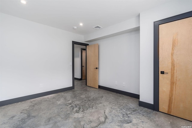 216 N St, Greenport, NY 11944 - spare room featuring recessed lighting, a smoke detector, and concrete floors