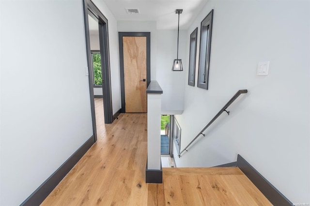 216 N St, Greenport, NY 11944 - hallway featuring an upstairs landing and light wood-type flooring
