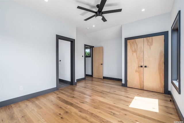 216 N St, Greenport, NY 11944 - unfurnished bedroom featuring light wood finished floors, vaulted ceiling, recessed lighting, and ceiling fan