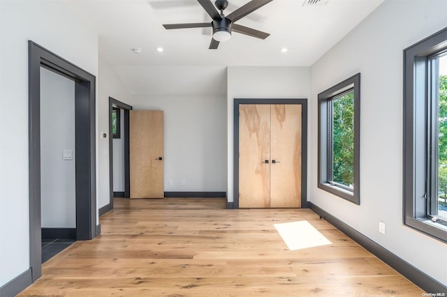 216 N St, Greenport, NY 11944 - unfurnished bedroom with light wood finished floors, recessed lighting, and a ceiling fan