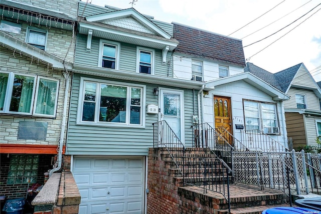 townhome / multi-family property featuring a garage