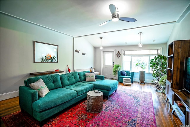 living room with ceiling fan, hardwood / wood-style floors, and lofted ceiling