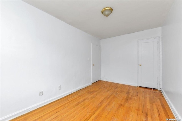 unfurnished room featuring light hardwood / wood-style flooring