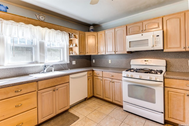 kitchen featuring sink, crown molding, white appliances, light brown cabinetry, and light tile patterned floors