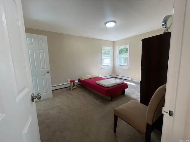 carpeted bedroom featuring baseboard heating