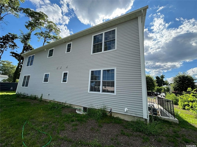 back of property with a lawn