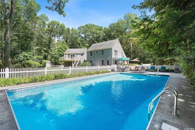 view of swimming pool featuring a patio