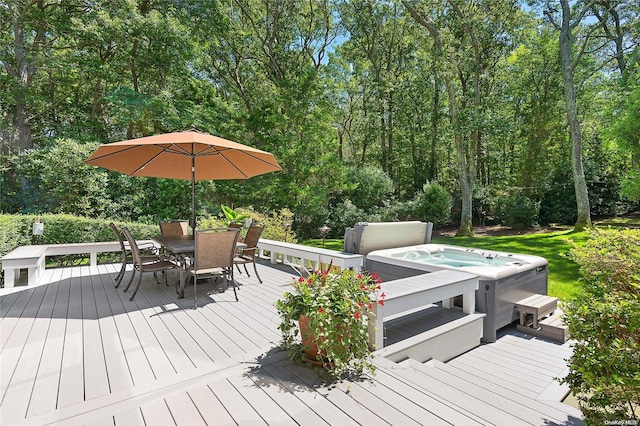 wooden deck featuring a hot tub